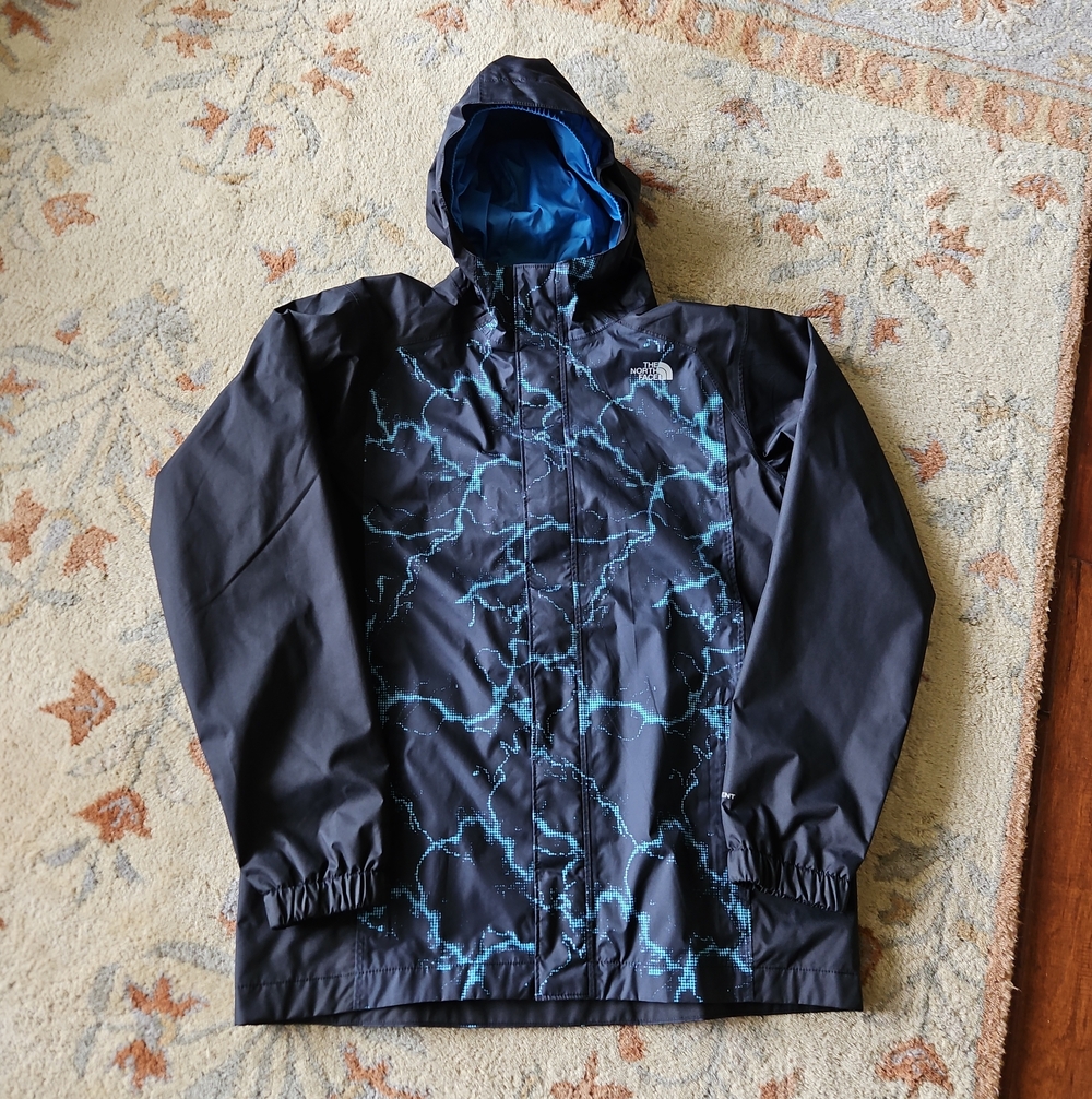 The North Face Kids Black Raincoat with Blue Lightning Print